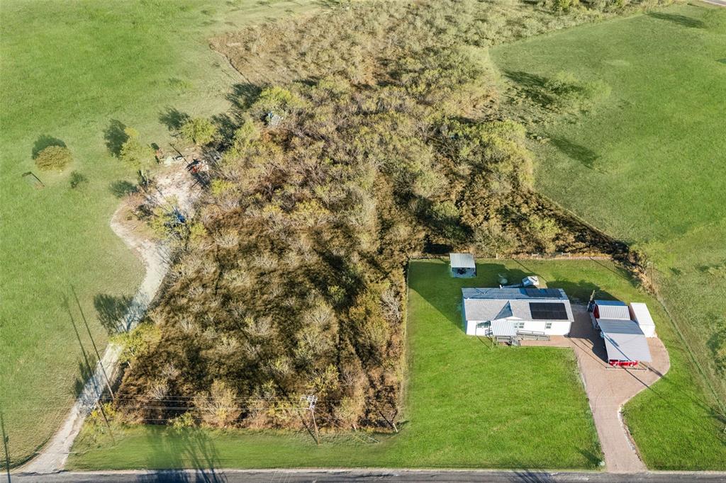 10240 Norrell Road Venus, TX 76084 - Photo 21 of 22 swimming pool view with a garden