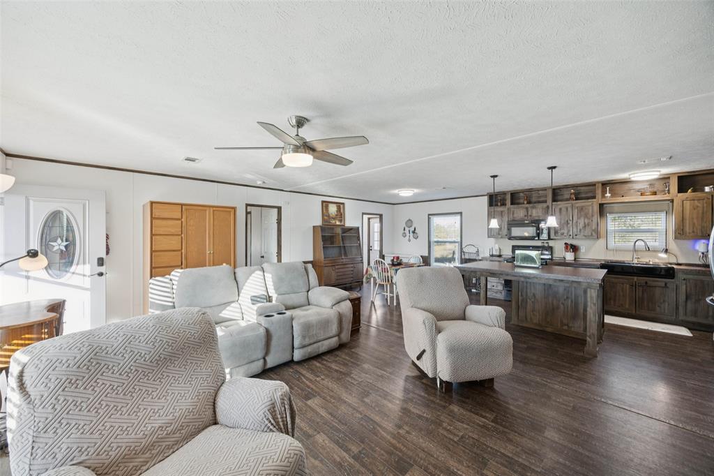 10240 Norrell Road Venus, TX 76084 - Photo 4 of 22 a living room with furniture and kitchen view