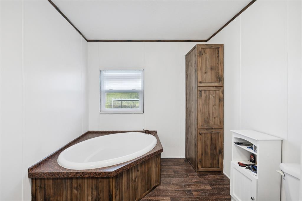 10240 Norrell Road Venus, TX 76084 - Photo 10 of 22 a bathroom with a bathtub and shower