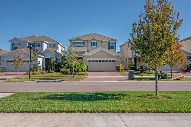 a front view of house with yard and green space