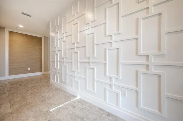 a white toilet sitting next to a bath tub