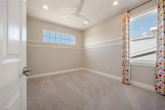 a view of a chandelier in big room and chandelier