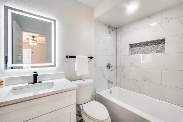 a bathroom with a sink a toilet and a bathtub