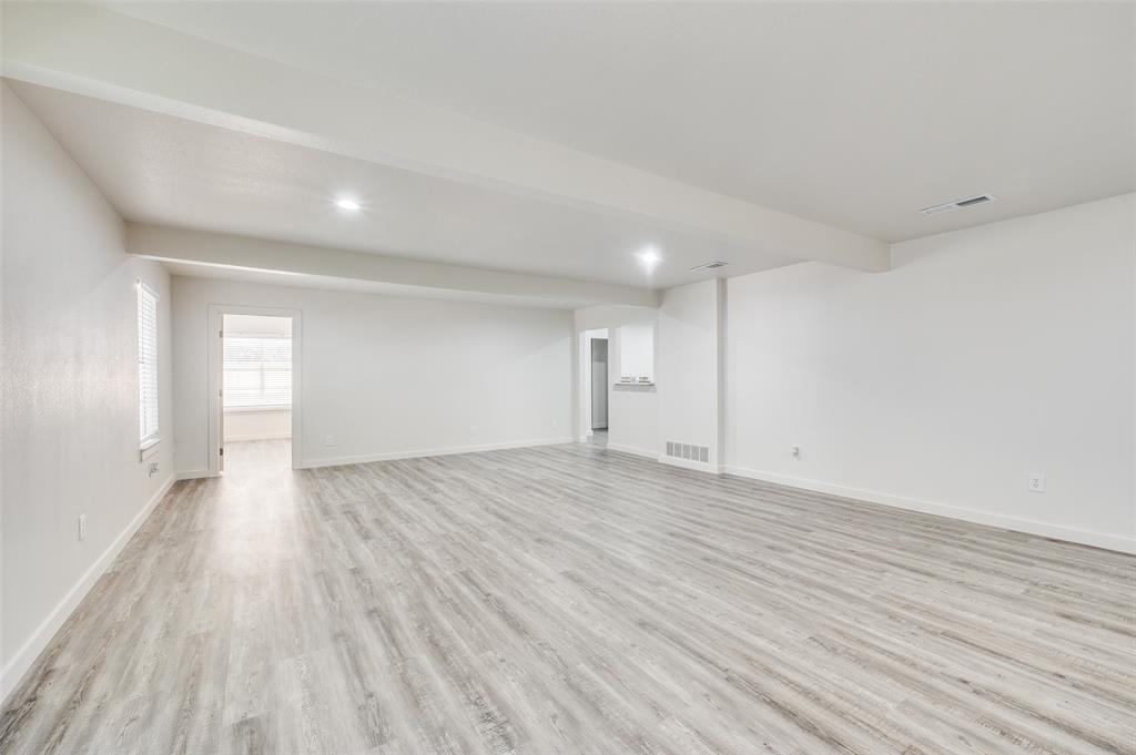 733 Southeast 3rd Street Grand Prairie, TX 75051 - Photo 7 of 24 Basement featuring light wood-type flooring and recessed lighting