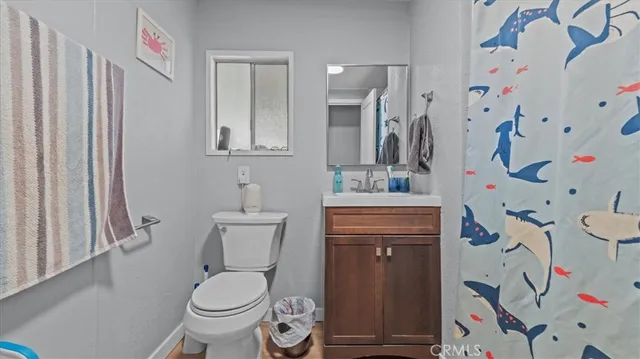 a utility room with refrigerator and washer
