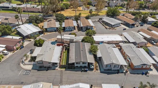 an aerial view of residential houses with city view