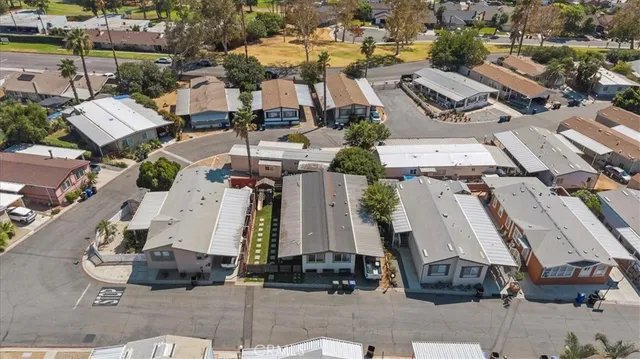 an aerial view of residential houses with city view