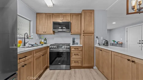 a bedroom with a bed and a refrigerator