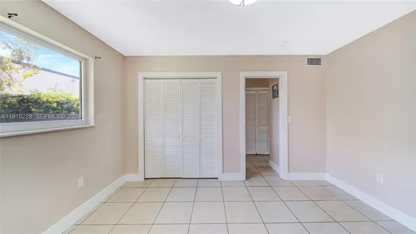 a view of an empty room with window