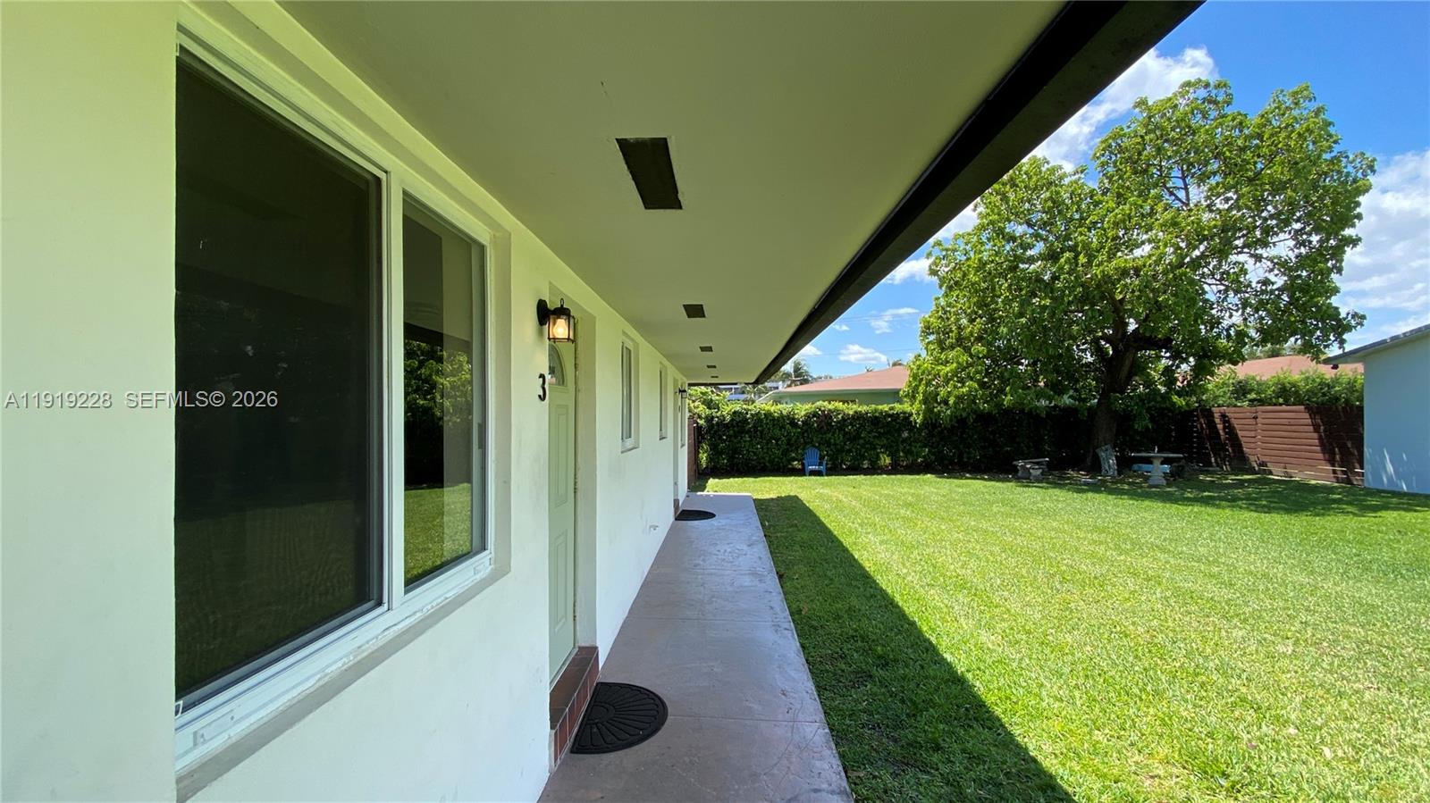 592 Northeast 150th Street, Unit 3 Miami, FL 33161 - Photo 3 of 22 a view of a back yard