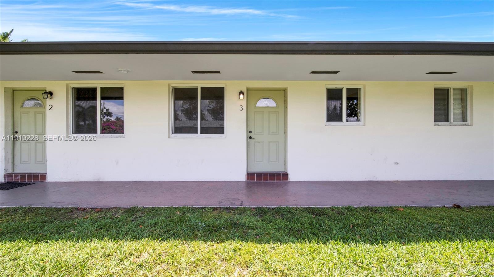 592 Northeast 150th Street, Unit 3 Miami, FL 33161 - Photo 5 of 22 a view of front of a house with a yard
