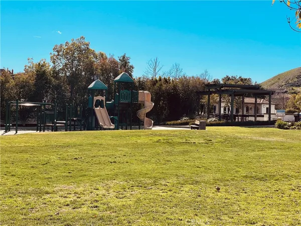 a view of a swimming pool with an outdoor space and seating area
