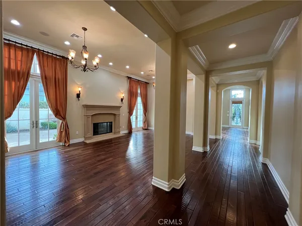 wooden floor in an empty room with a fireplace