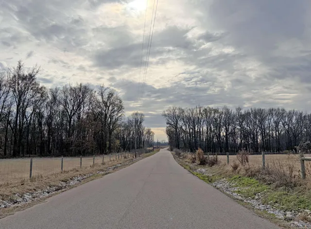 a view of a city street with a building