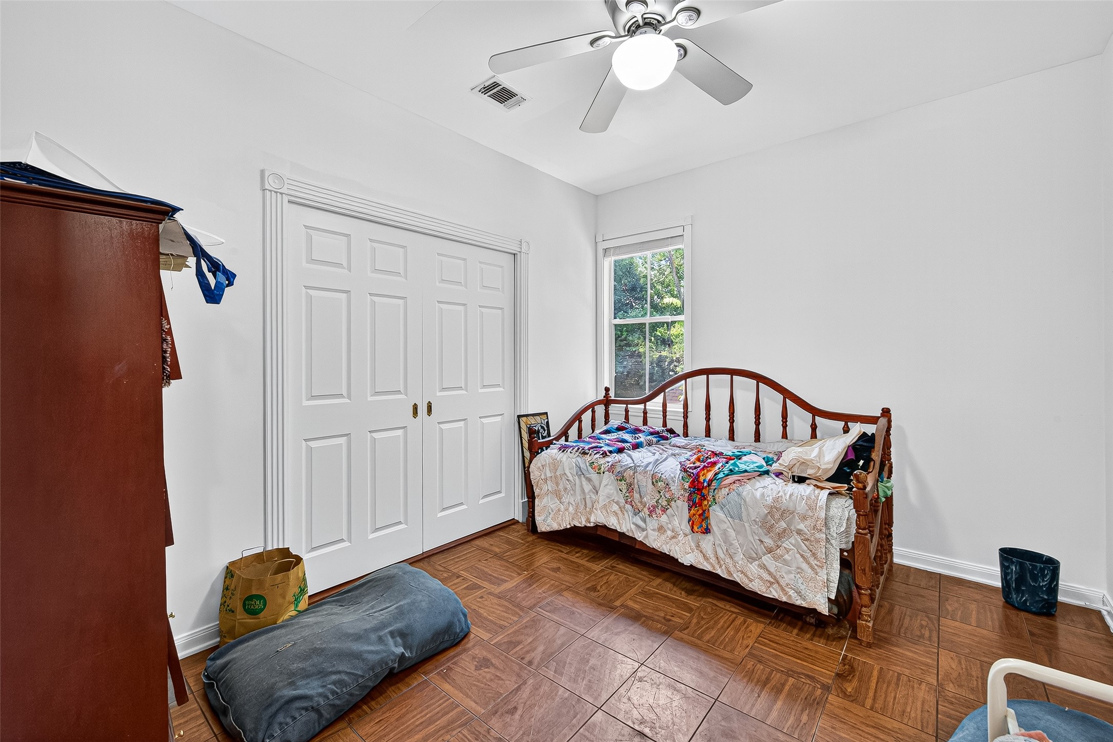 10116 Brighton Lane Houston, TX 77031 - Photo 35 of 50 a bedroom with a bed and wooden floor