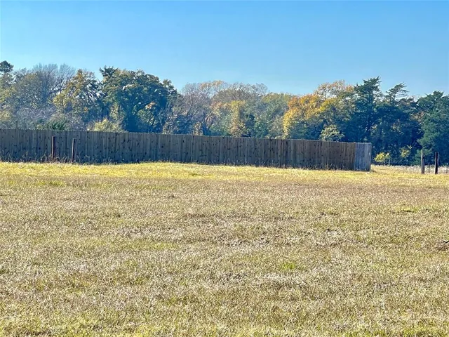 a view of patio and a yard