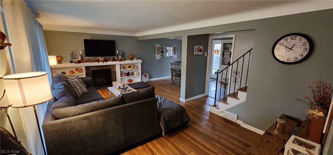 1293 Brainard Road Lyndhurst, OH 44124 - Photo 3 of 15 Living room featuring hardwood flooring. *TV does not stay but mount and hardware will remain.