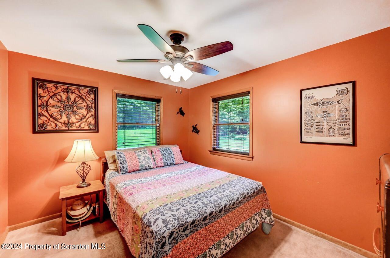 755 Spring Hill Road Sterling, PA 18463 - Photo 23 of 99 a bedroom with a bed and a window