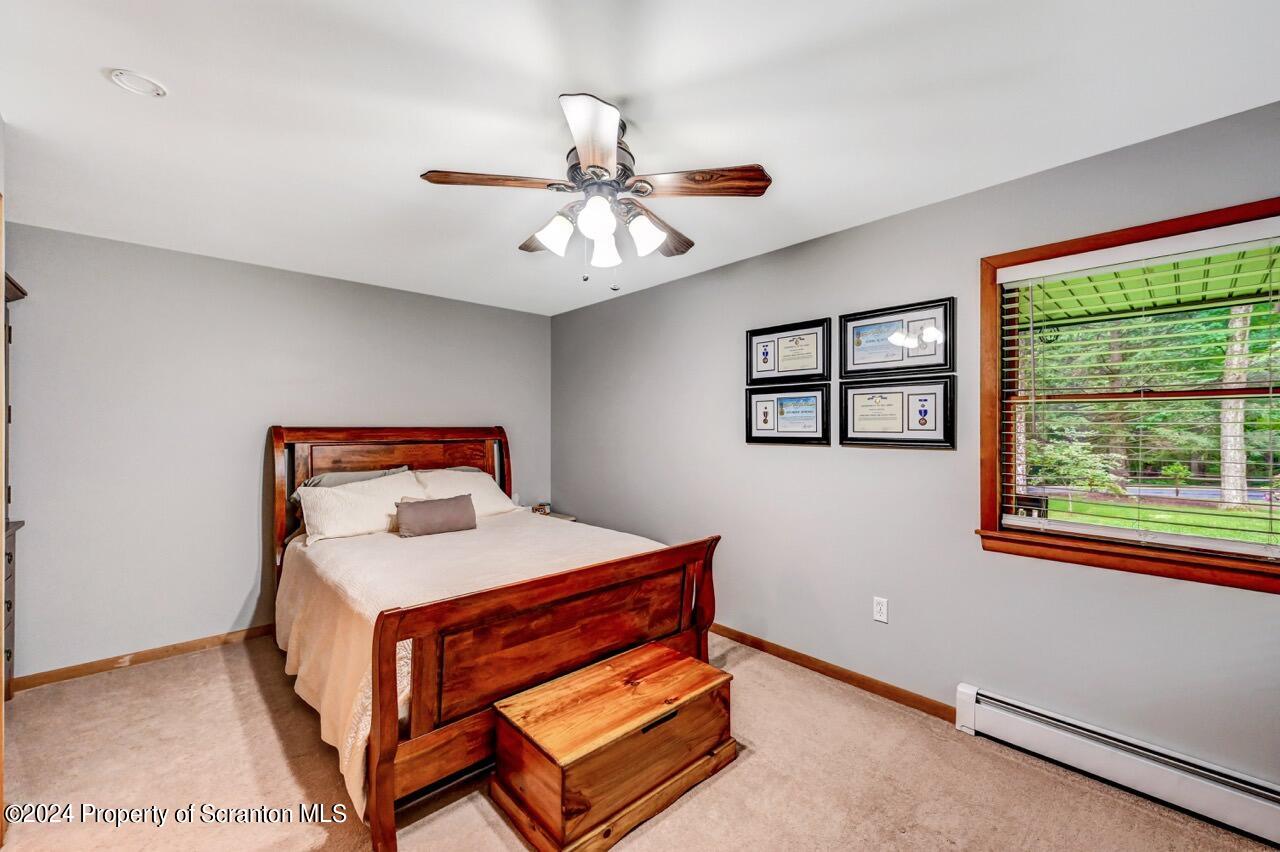 755 Spring Hill Road Sterling, PA 18463 - Photo 32 of 99 a room with a bed and a window