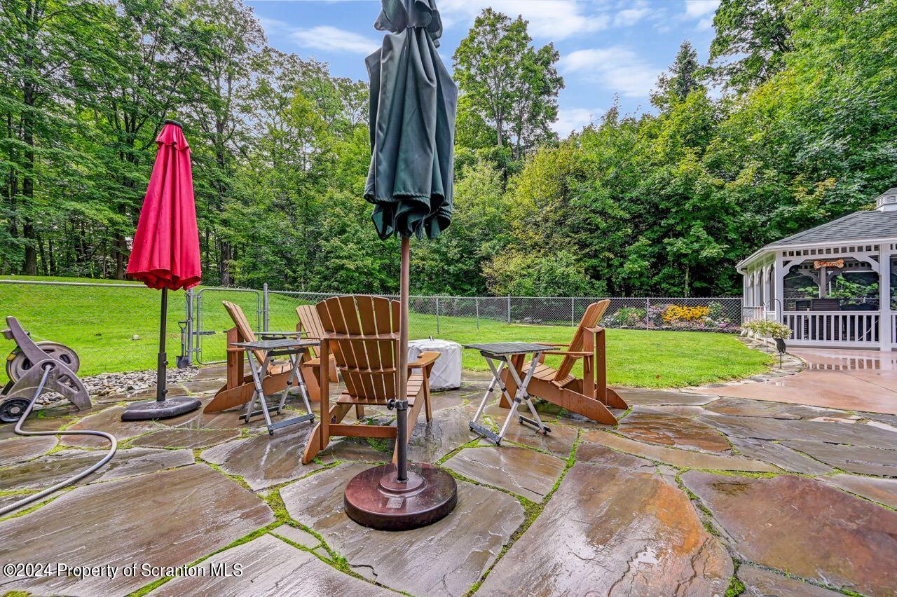 755 Spring Hill Road Sterling, PA 18463 - Photo 61 of 99 a view of a chairs and table in backyard of the house