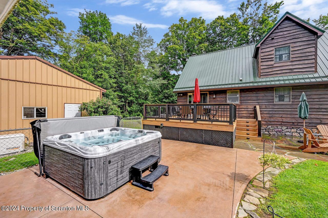 755 Spring Hill Road Sterling, PA 18463 - Photo 63 of 99 a view of a dinning table and chairs in the patio