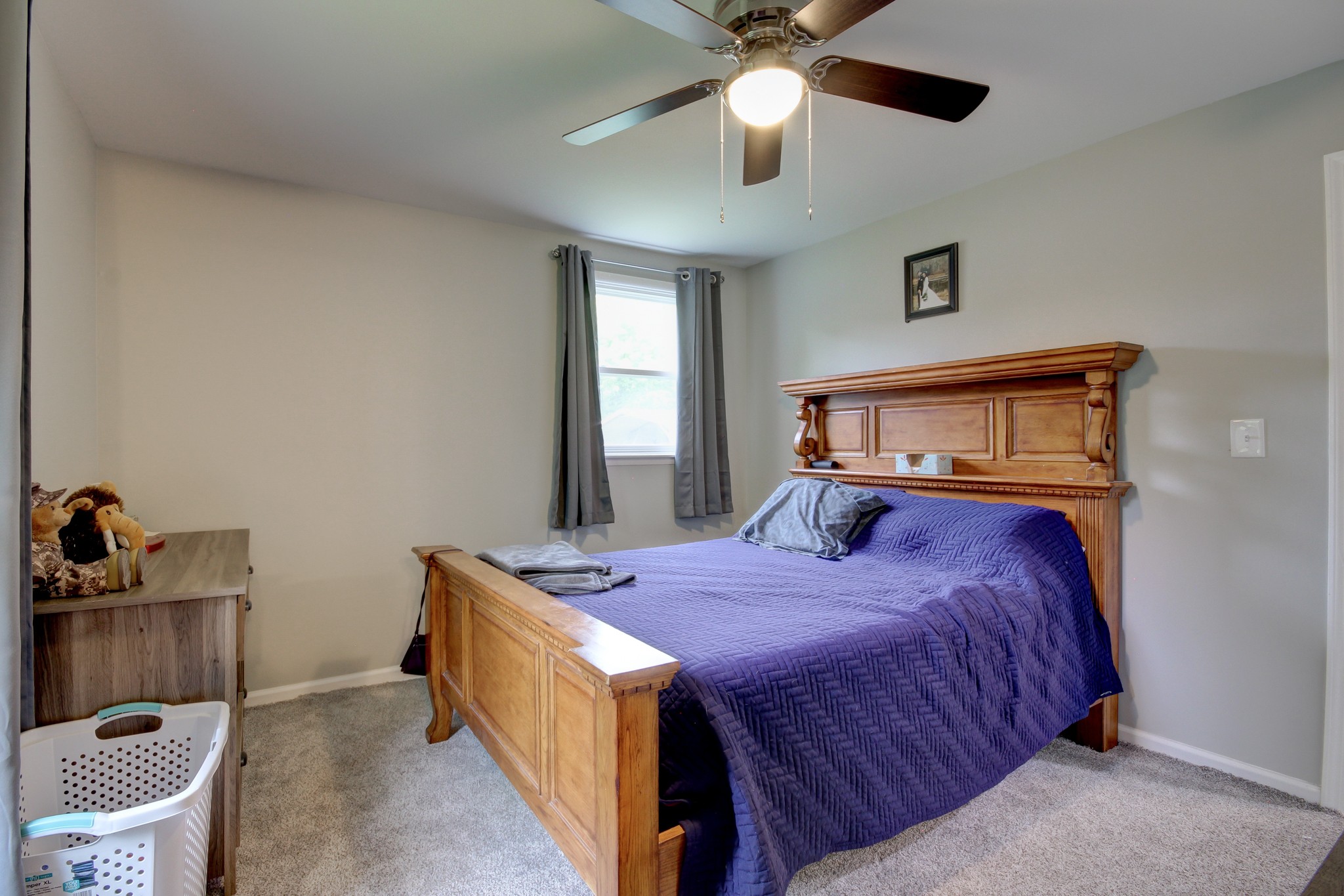 309 Burch Road Clarksville, TN 37042 - Photo 7 of 12 a bedroom with a bed and a chandelier