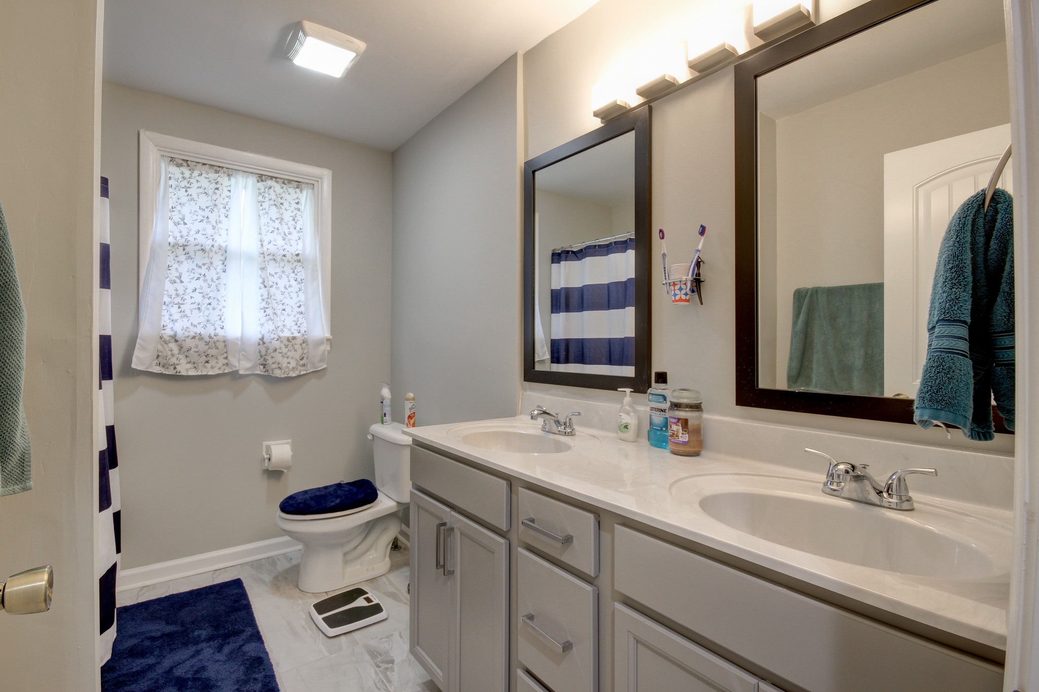 309 Burch Road Clarksville, TN 37042 - Photo 8 of 12 a bathroom with a toilet sink and mirror