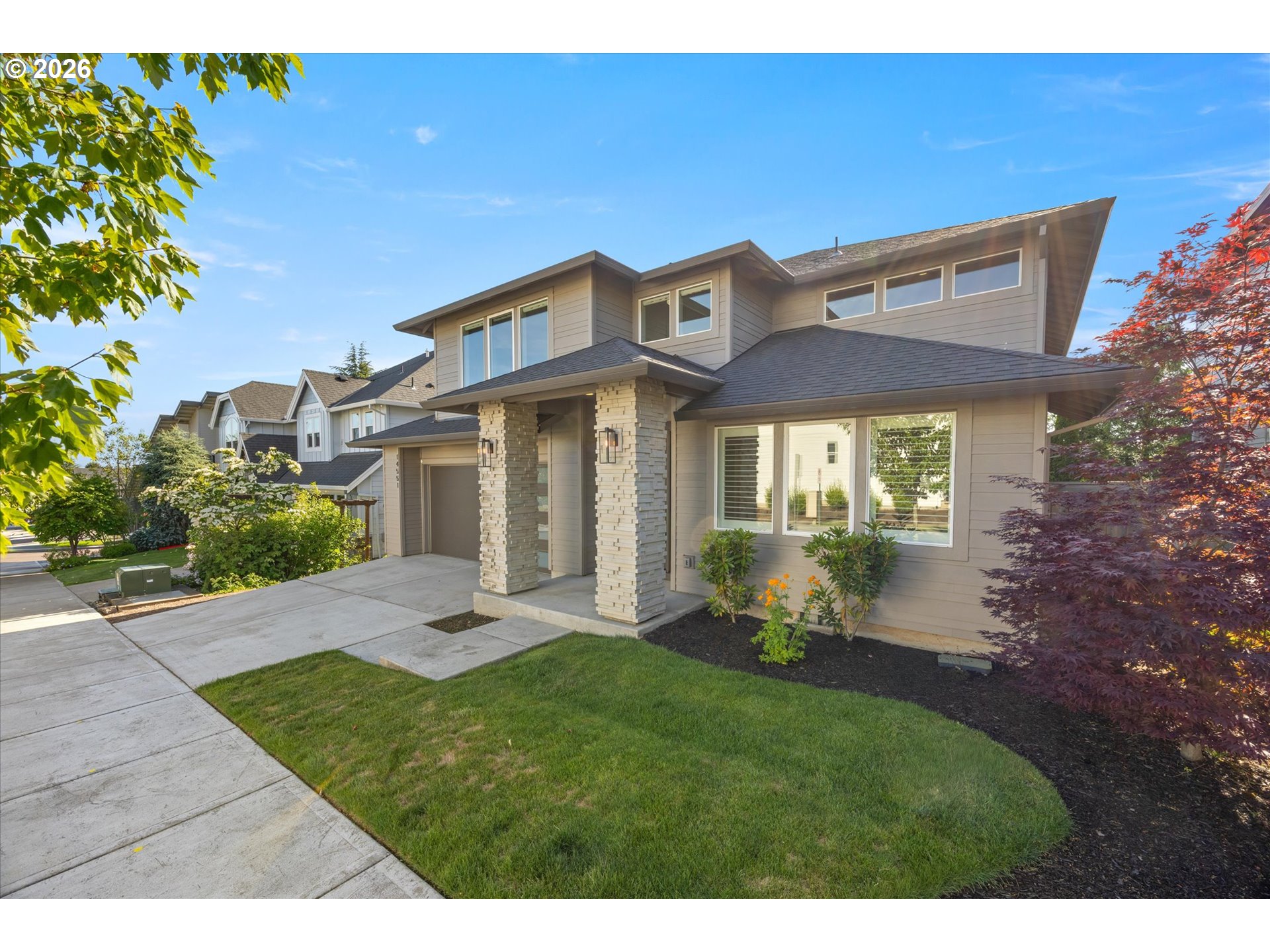 14551 Southwest 153rd Avenue Portland, OR 97224 - Photo 3 of 45 a front view of a house with a garden and yard