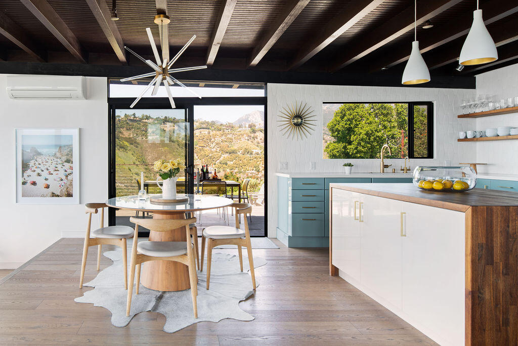 81 Chase Drive Santa Barbara, CA 93108 - Photo 7 of 22 a dining hall with stainless steel appliances granite countertop a stove and a view of dining room with wooden floor