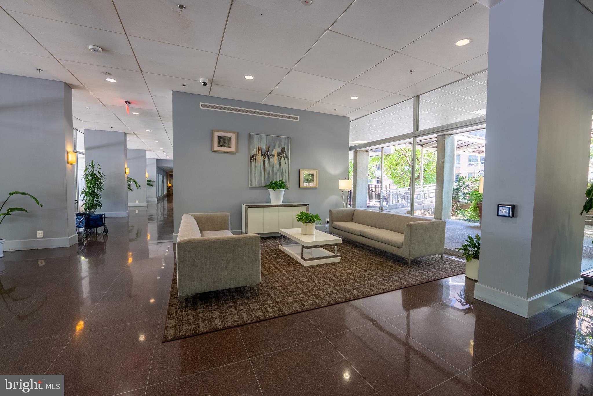 800 4th Street Southwest, Unit N312 Washington, DC 20024 - Photo 16 of 16 a living room with furniture and a large window