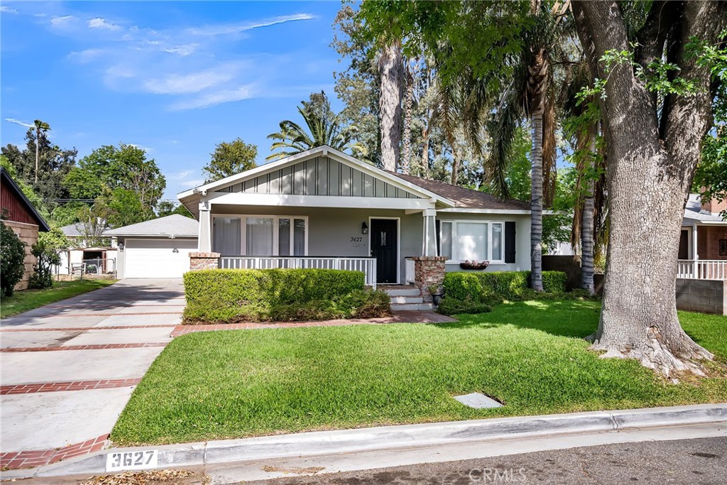 3627 Mariella Street Riverside, CA 92504 - Photo 1 of 1 a front view of a house with a yard