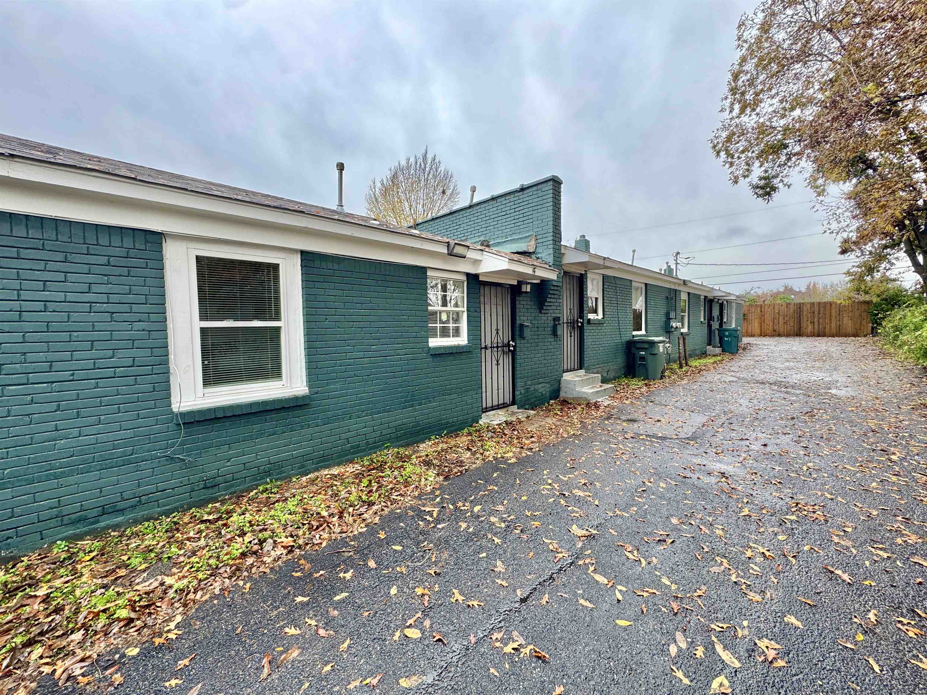 1825 Castalia Street Memphis, TN 38114 - Photo 2 of 30 a view of a brick house with a yard