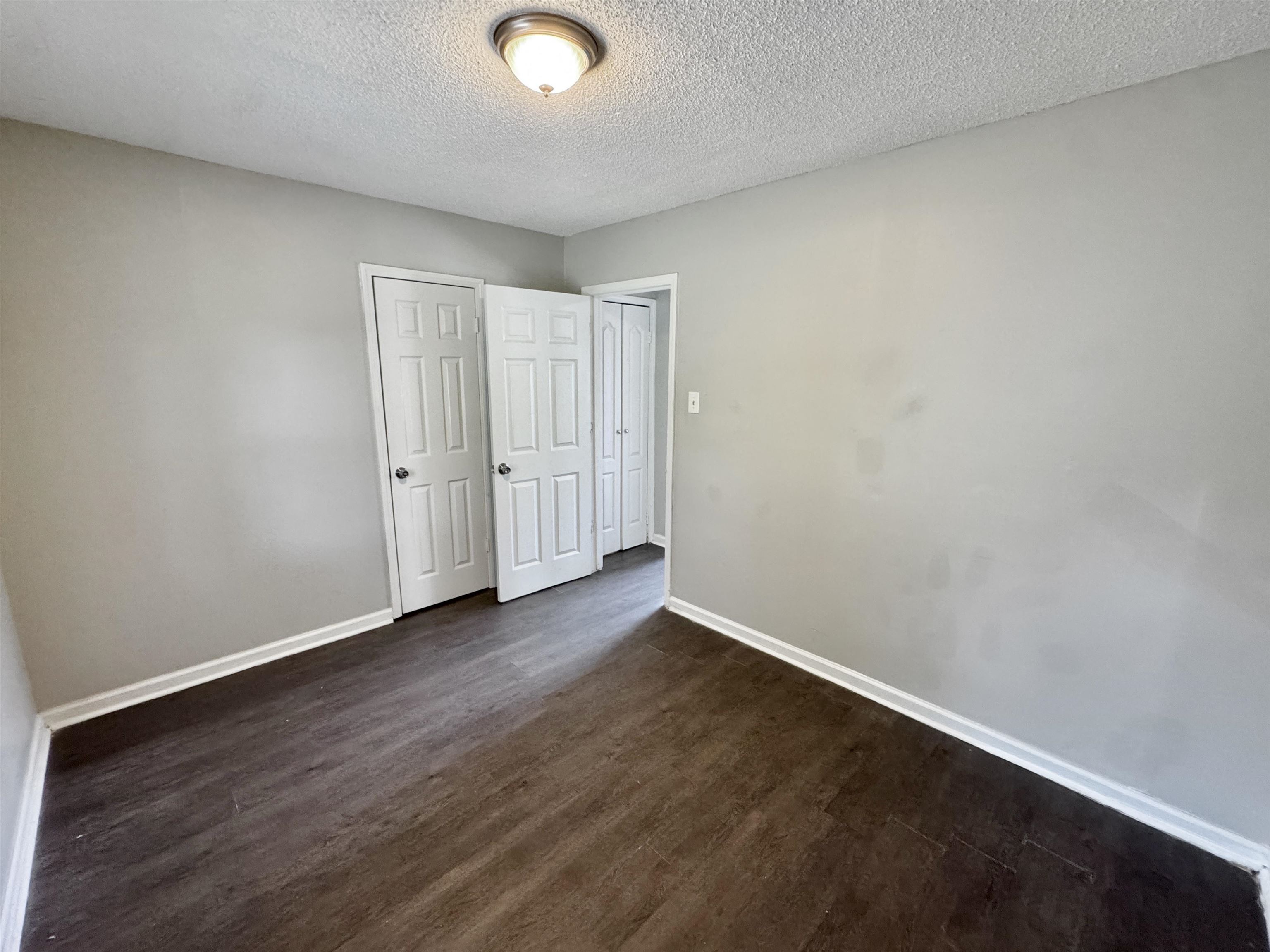 1825 Castalia Street Memphis, TN 38114 - Photo 28 of 30 an empty room with wooden floor
