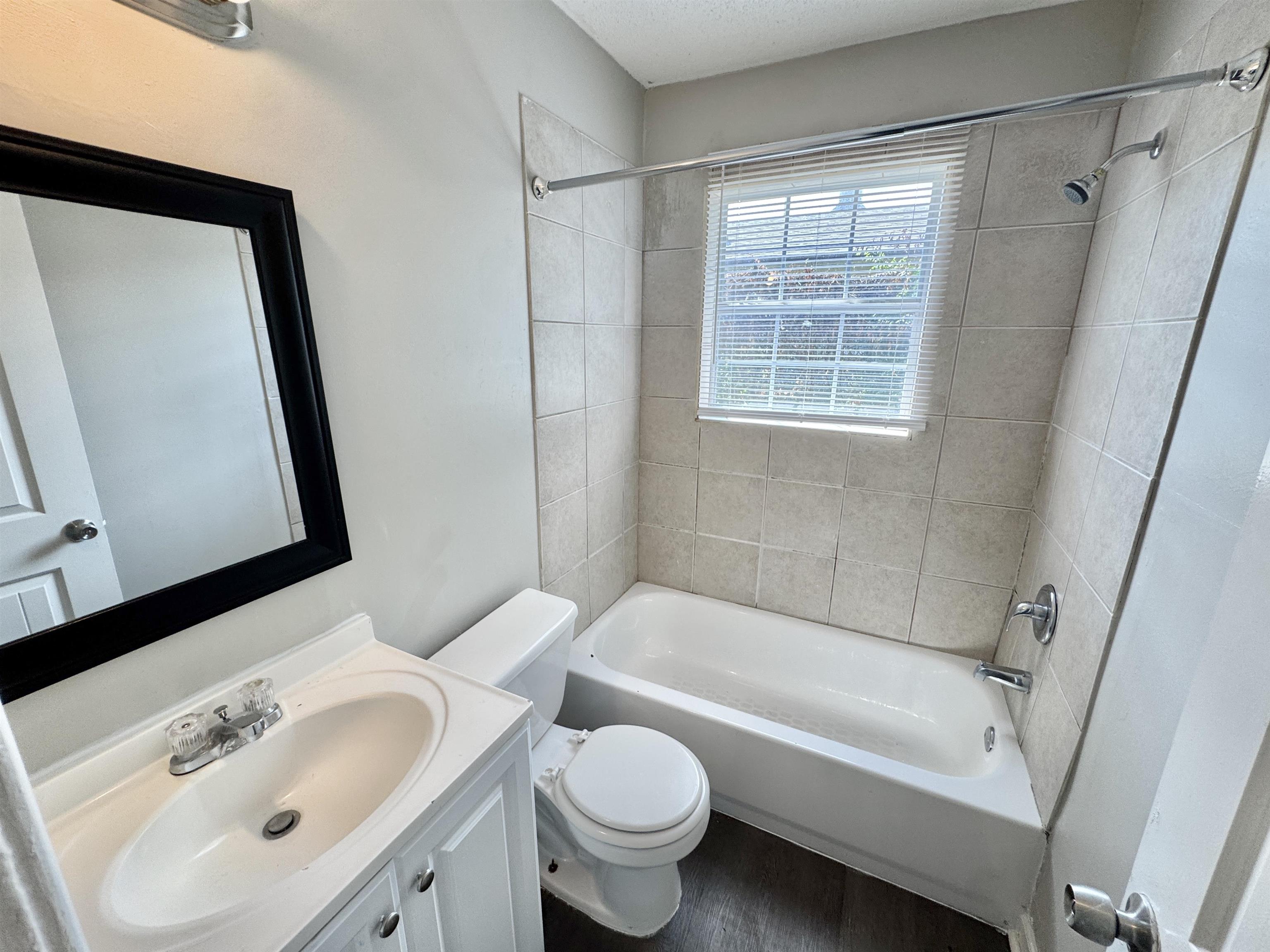 1825 Castalia Street Memphis, TN 38114 - Photo 29 of 30 a bathroom with a sink toilet and shower