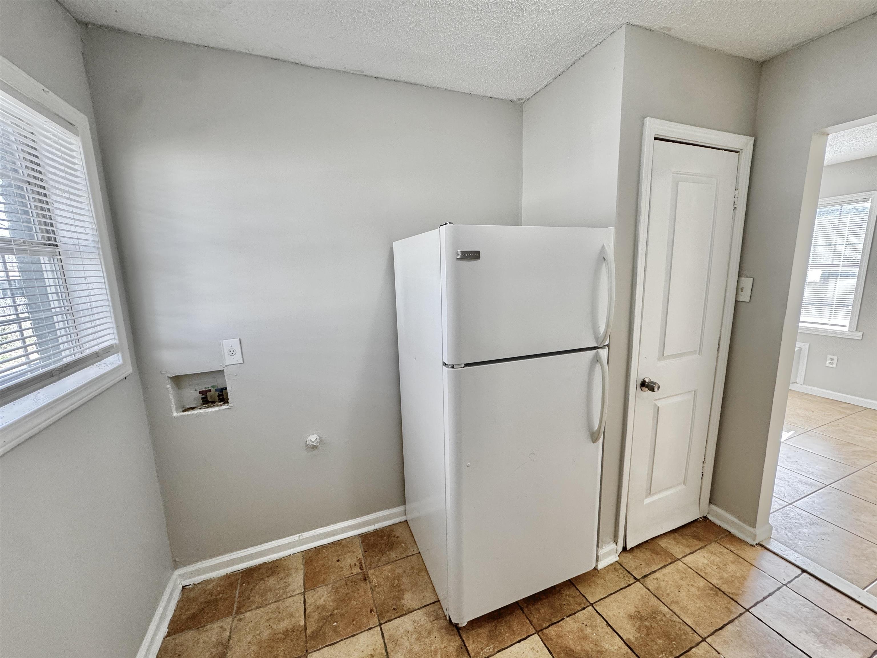 1825 Castalia Street Memphis, TN 38114 - Photo 5 of 30 a view of kitchen with a refrigerator