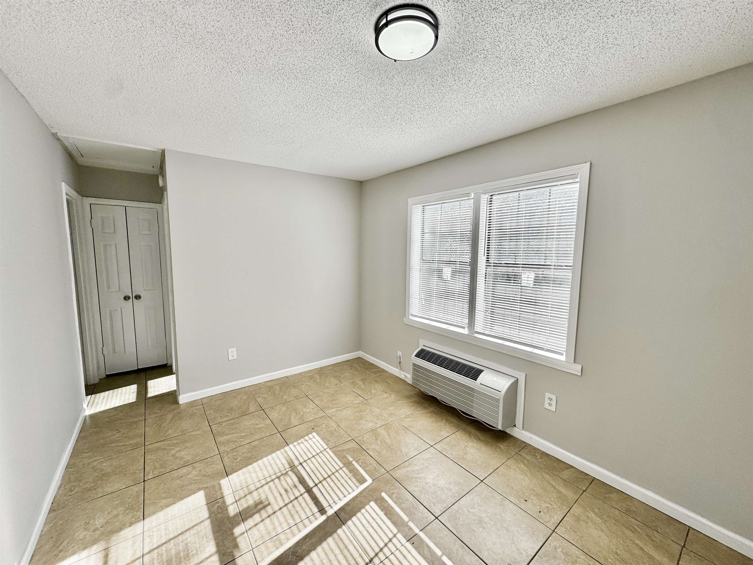 1825 Castalia Street Memphis, TN 38114 - Photo 6 of 30 an empty room with windows