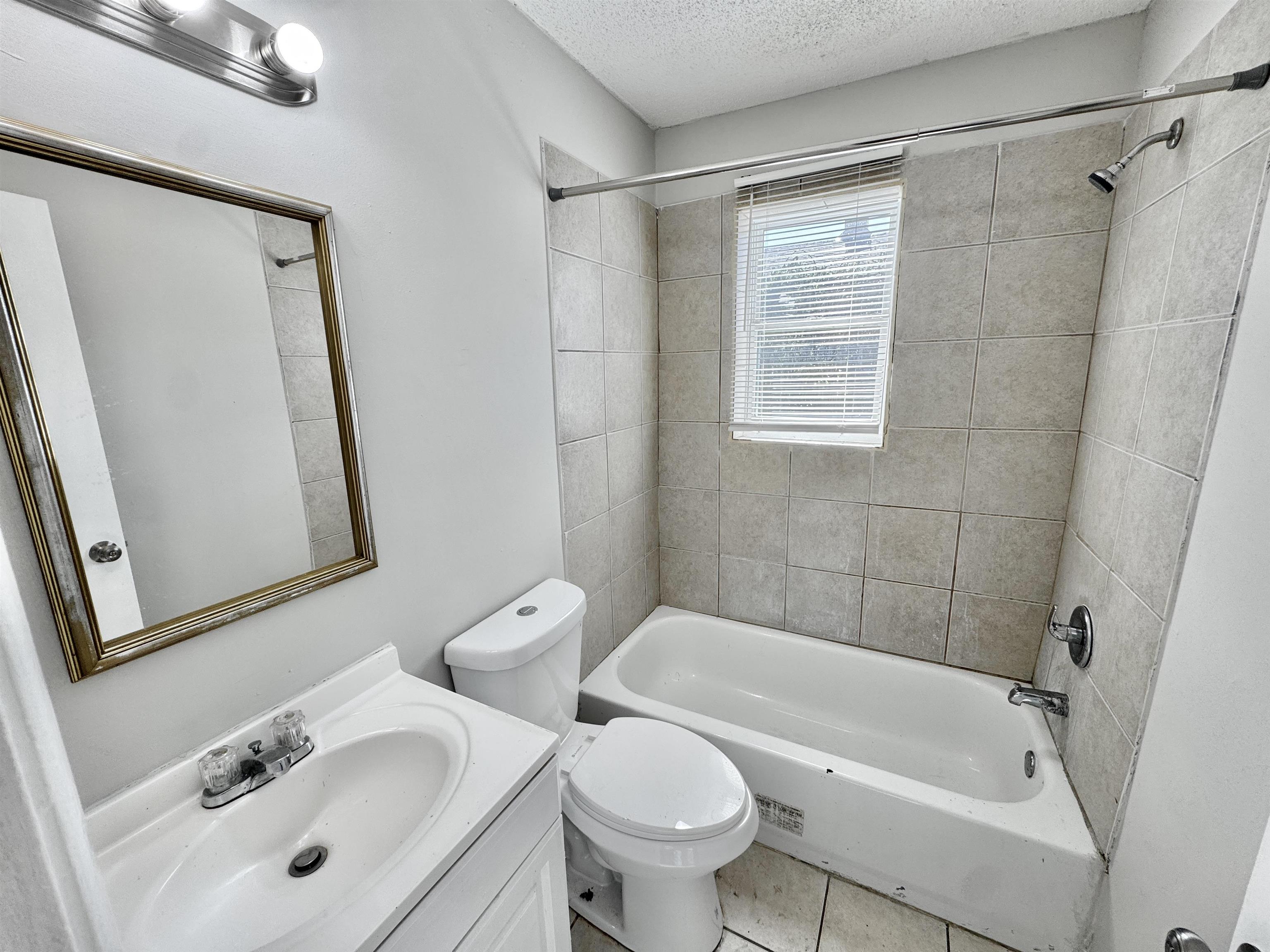 1825 Castalia Street Memphis, TN 38114 - Photo 7 of 30 a bathroom with a sink toilet and shower