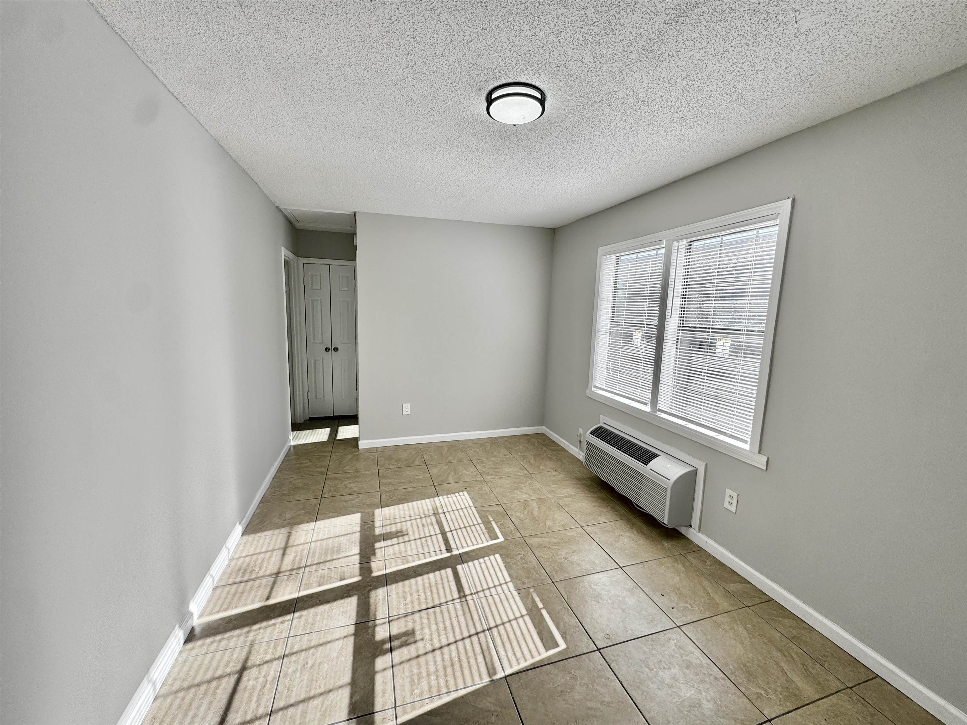 1825 Castalia Street Memphis, TN 38114 - Photo 10 of 30 a view of an empty room and window