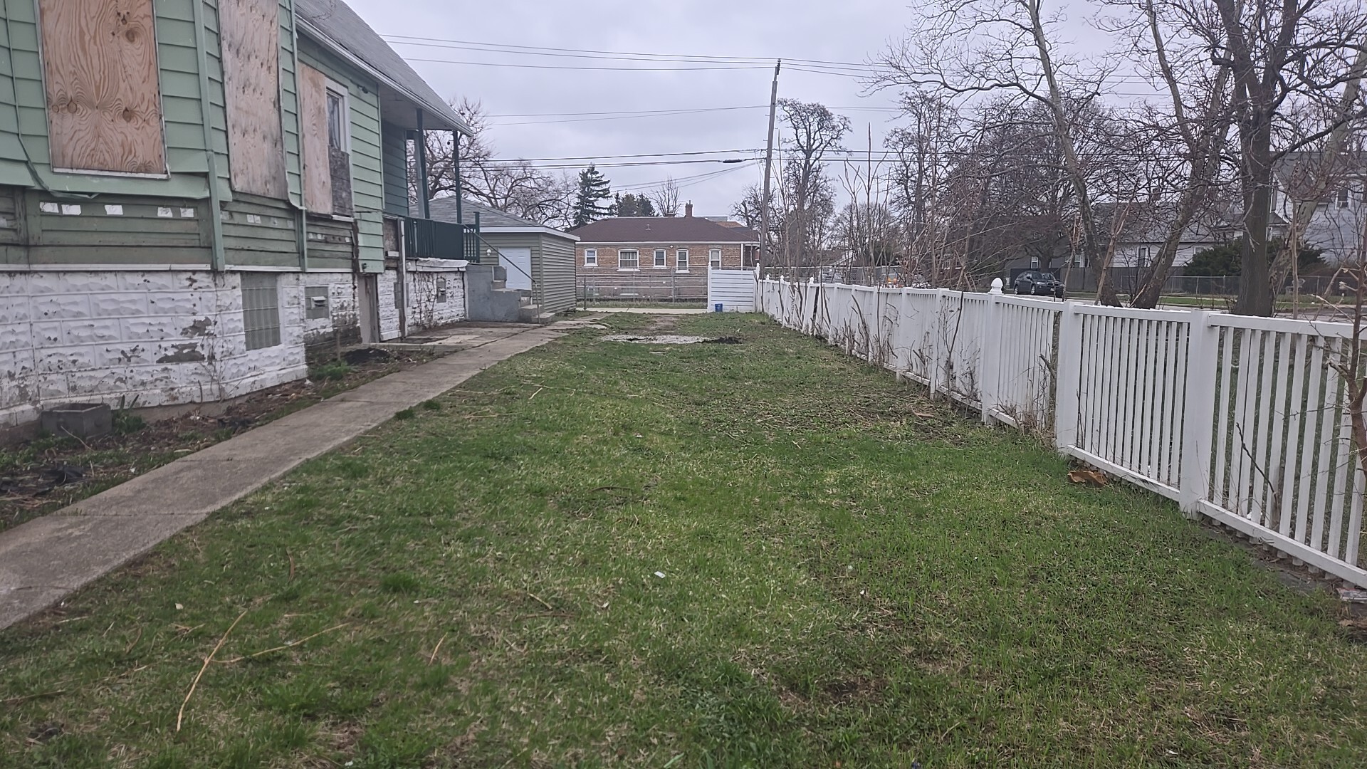 738 West 103rd Street Chicago, IL 60628 - Photo 6 of 20 a view of a yard in front of a building