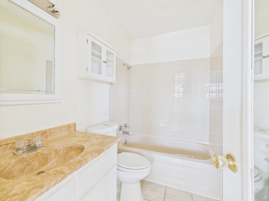 3000 Guadalupe Street, Unit 314 Austin, TX 78705 - Photo 8 of 12 a bathroom with a sink a toilet and shower