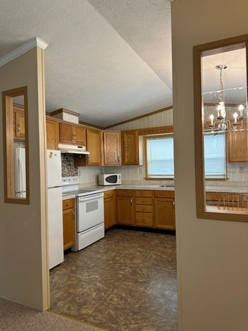 189 Springfield Road, Unit 24 Westfield, MA 01085 - Photo 6 of 22 a large kitchen with a stove top oven sink and cabinets