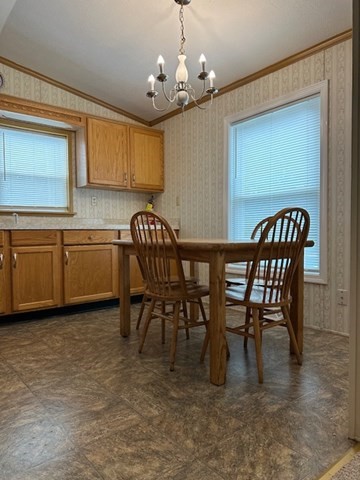 189 Springfield Road, Unit 24 Westfield, MA 01085 - Photo 8 of 22 a view of a dining room with furniture and chandelier