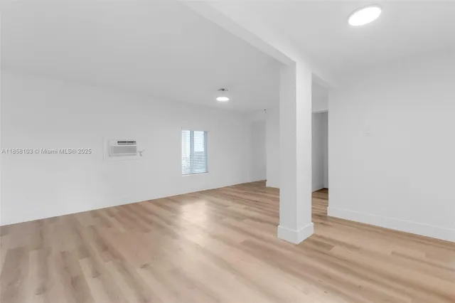 a view of an empty room and window