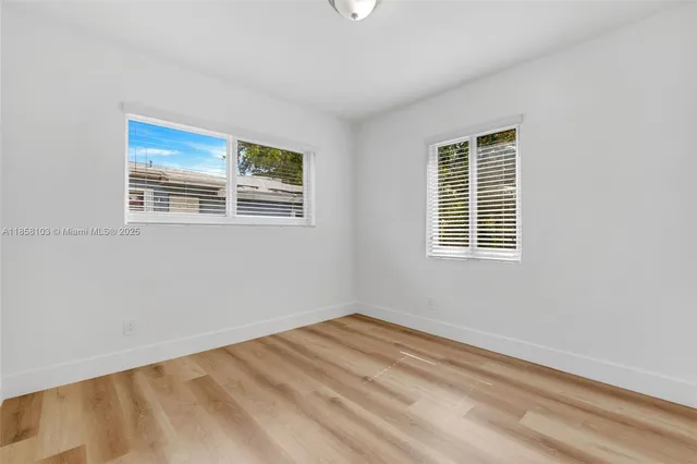 a view of empty room with windows