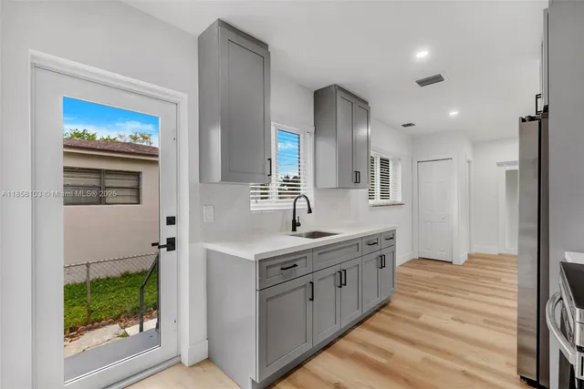 a view of an empty room and a window