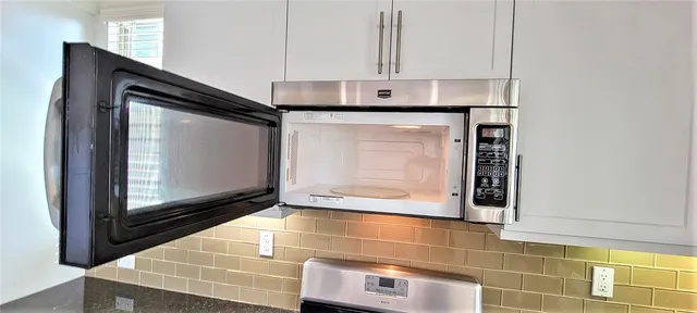 a view of staircase with white walls