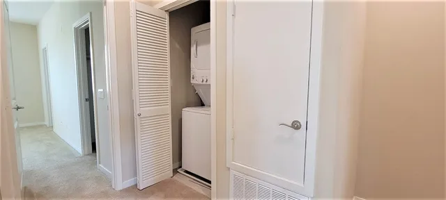a bathroom with a double vanity sink a mirror and a shower
