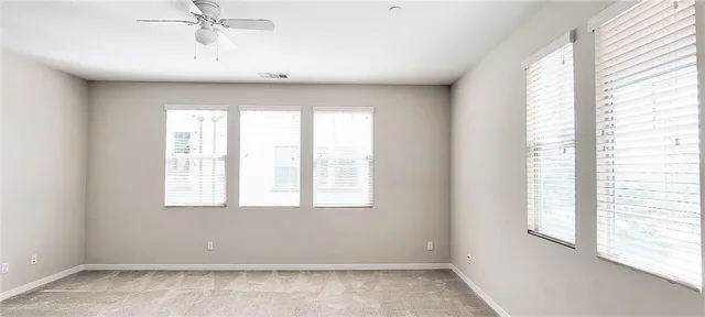 a bathroom with a window and a shower