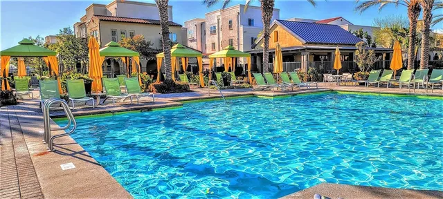 a view of a park with swings and slides