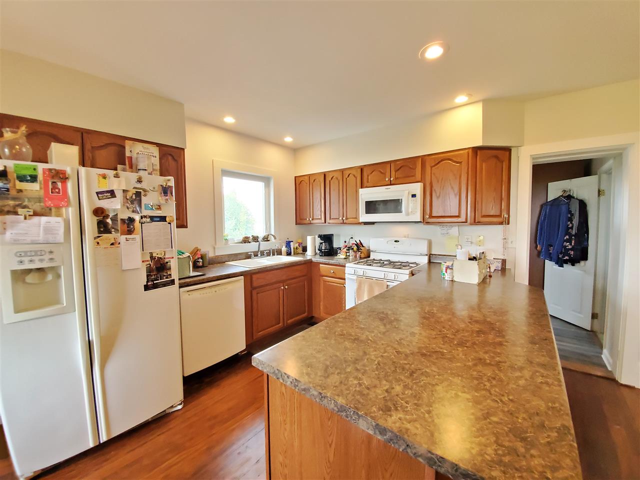 9700 West Edgewood Road Dixon, IL 61021 - Photo 8 of 36 a kitchen with stainless steel appliances granite countertop a refrigerator sink and cabinets